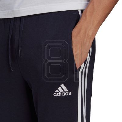 5. adidas Essentials Fleece Tapered Cuff 3-Band M GK8823 Hose