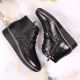 21. Gefütterte schwarze Lackleder-Stiefeletten mit Keilabsatz Filippo