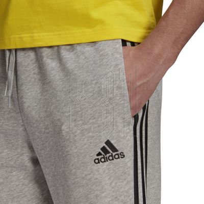 4. adidas Essentials Tapered Cuff 3 Stripes M GK8889 Hose